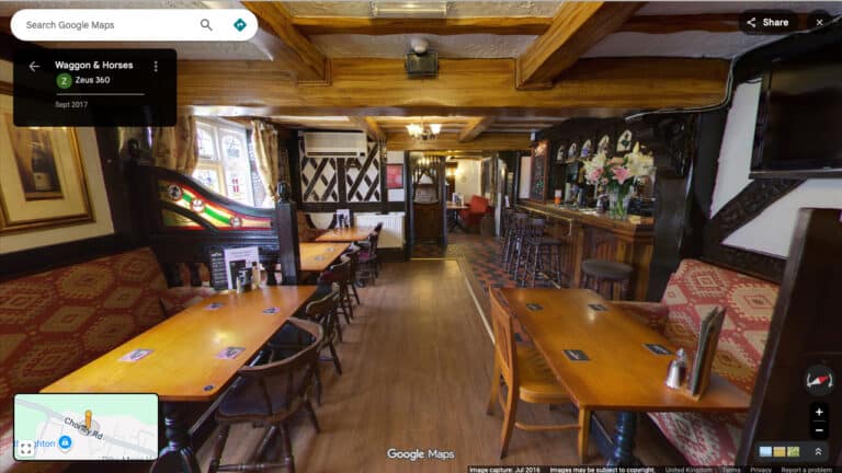 A 360-degree Google Street View virtual tour navigating through a stylish, modern restaurant and bar area.
