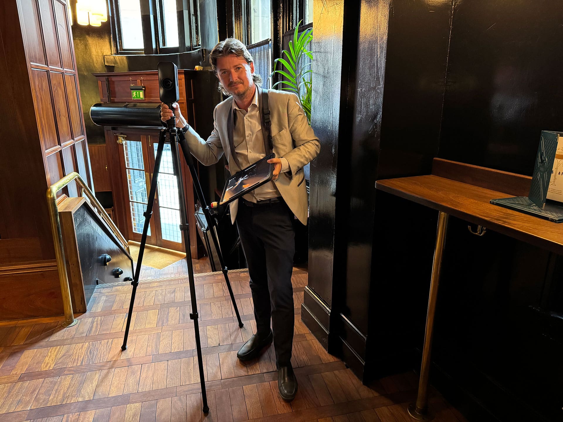 Graham Brown, founder of independent virtual tour company Zeus 360 in Manchester, setting up a 3D Matterport camera for a commercial venue scan.